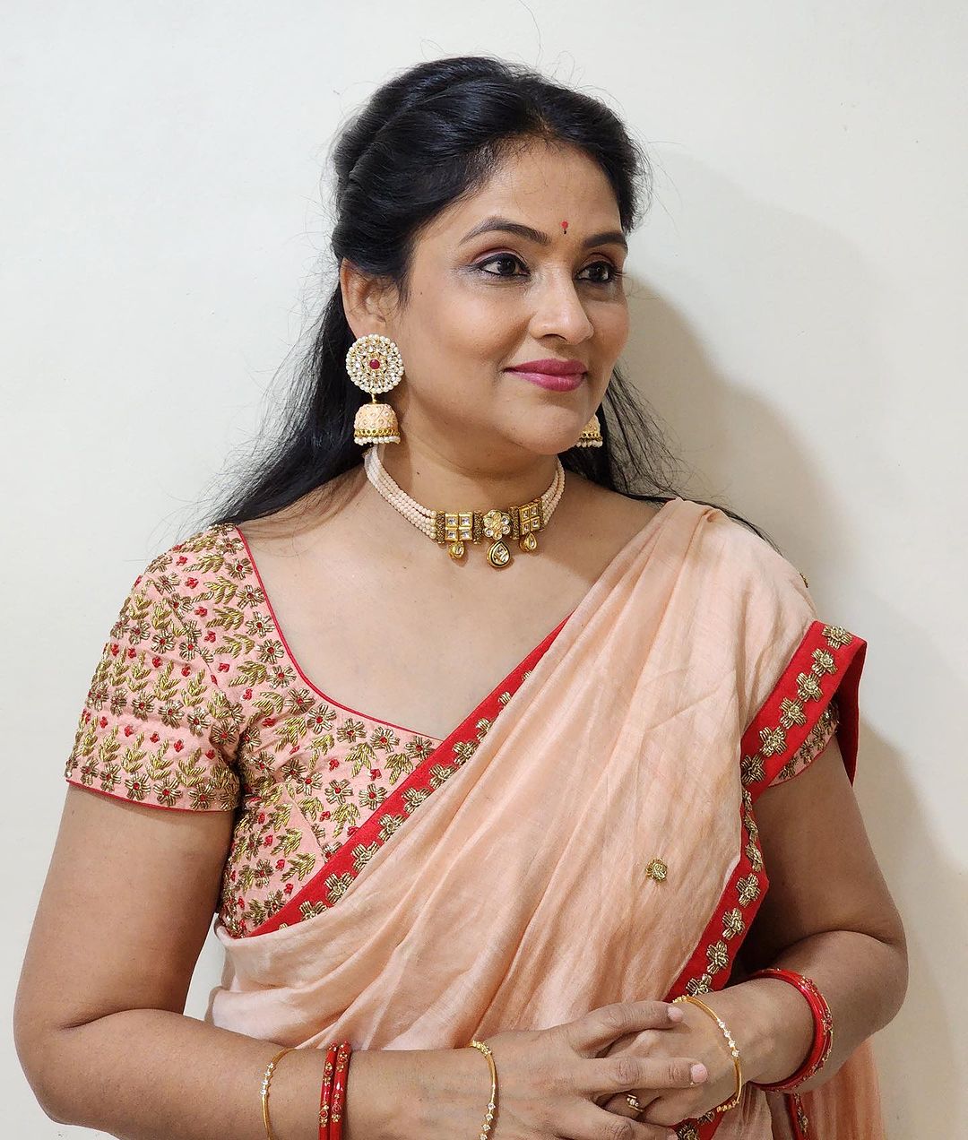 Telugu Actress Gayatri Bhargavi Stills in Orange Saree